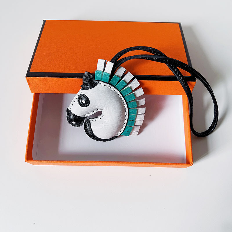 Handsewn unicorn pendant