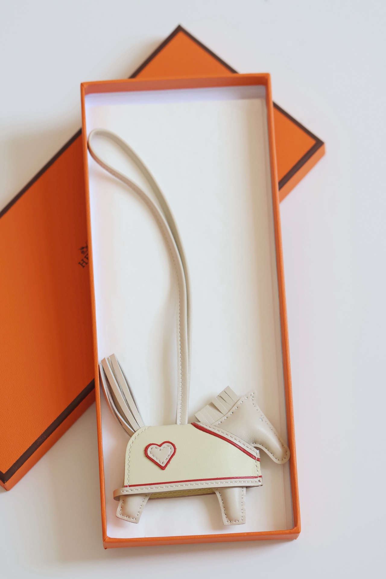 H Hand sewn pony pendant